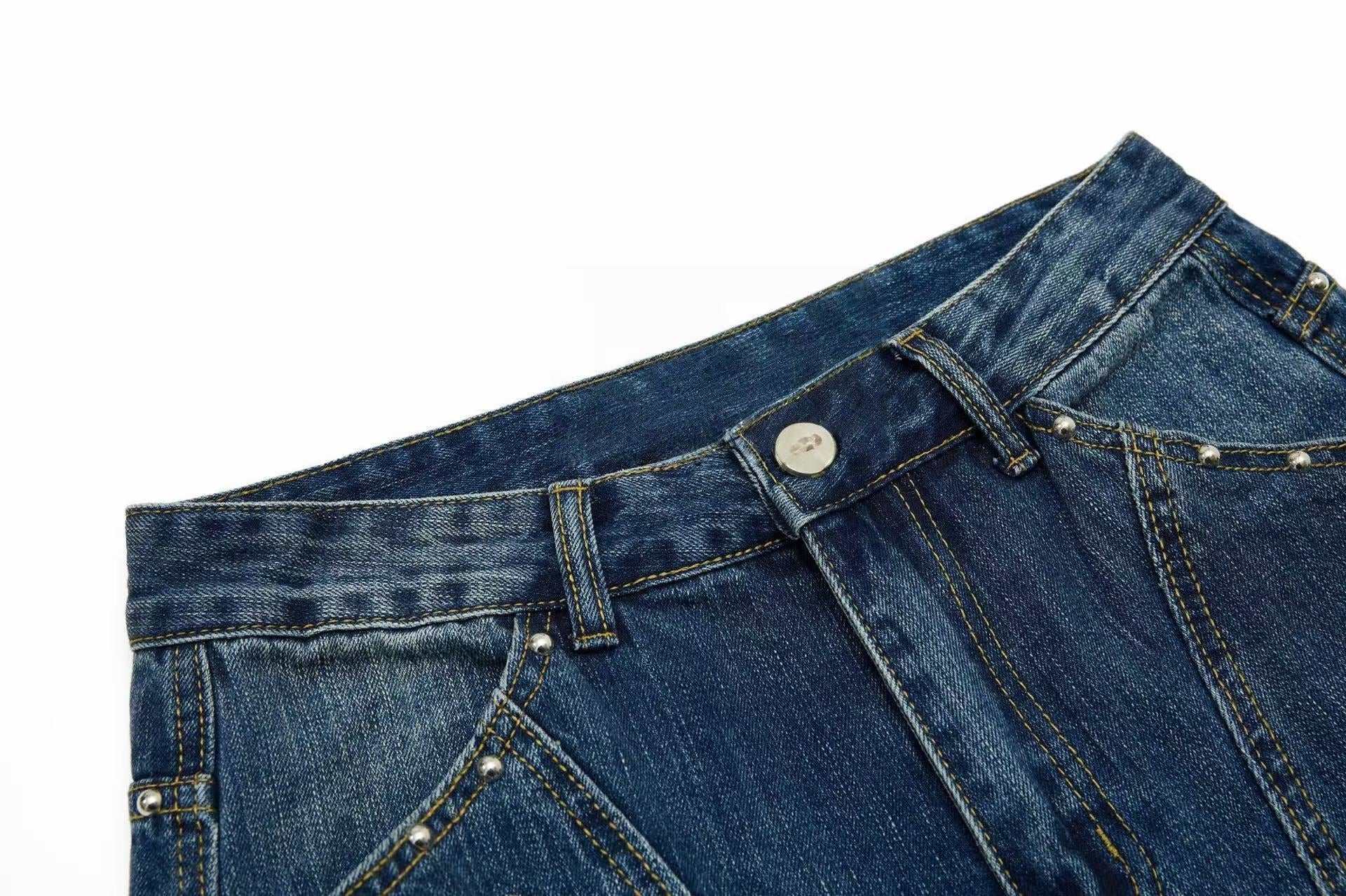 CapCabin “Studded Panel Denim Jeans”