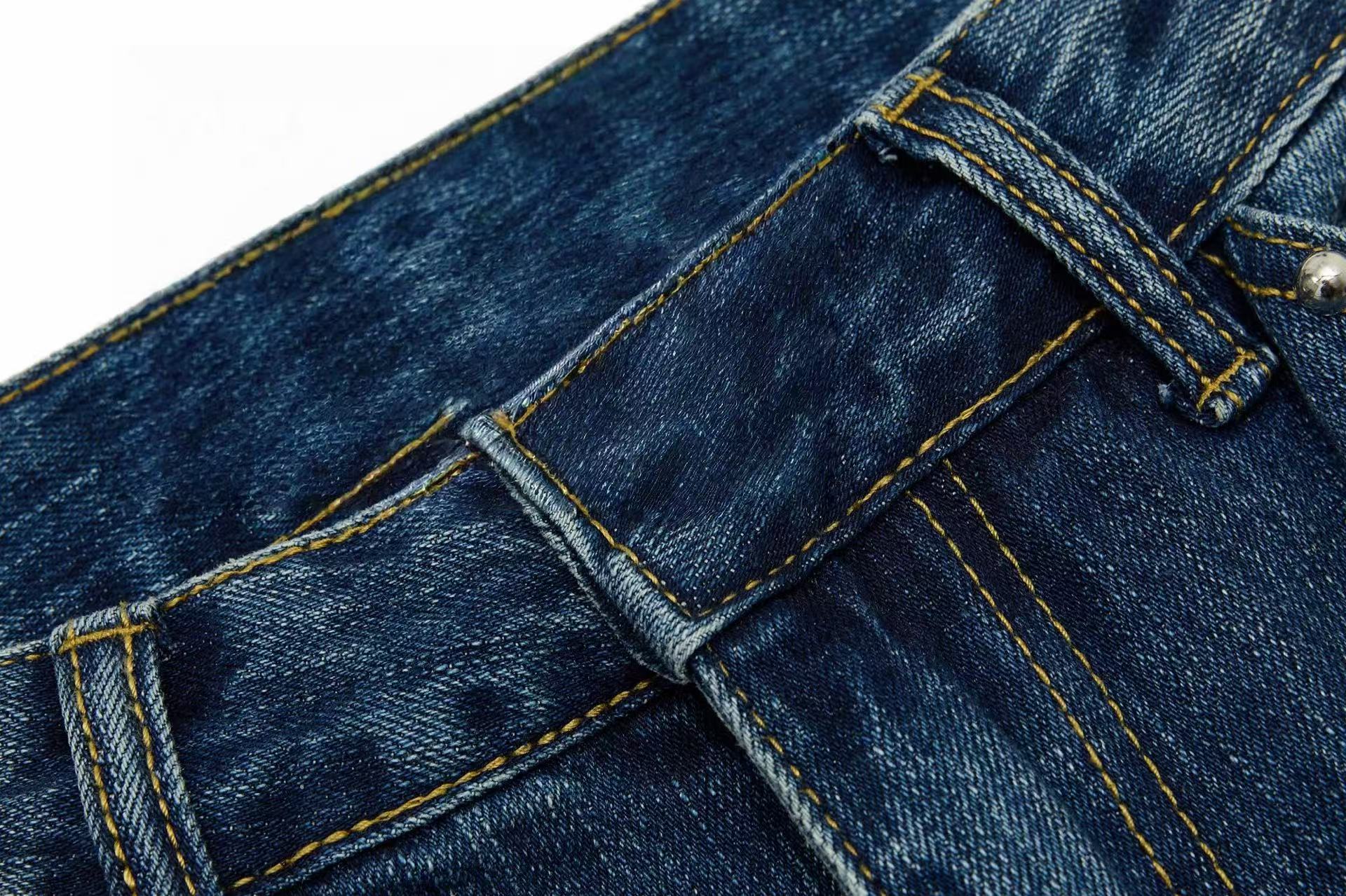 CapCabin “Studded Panel Denim Jeans”