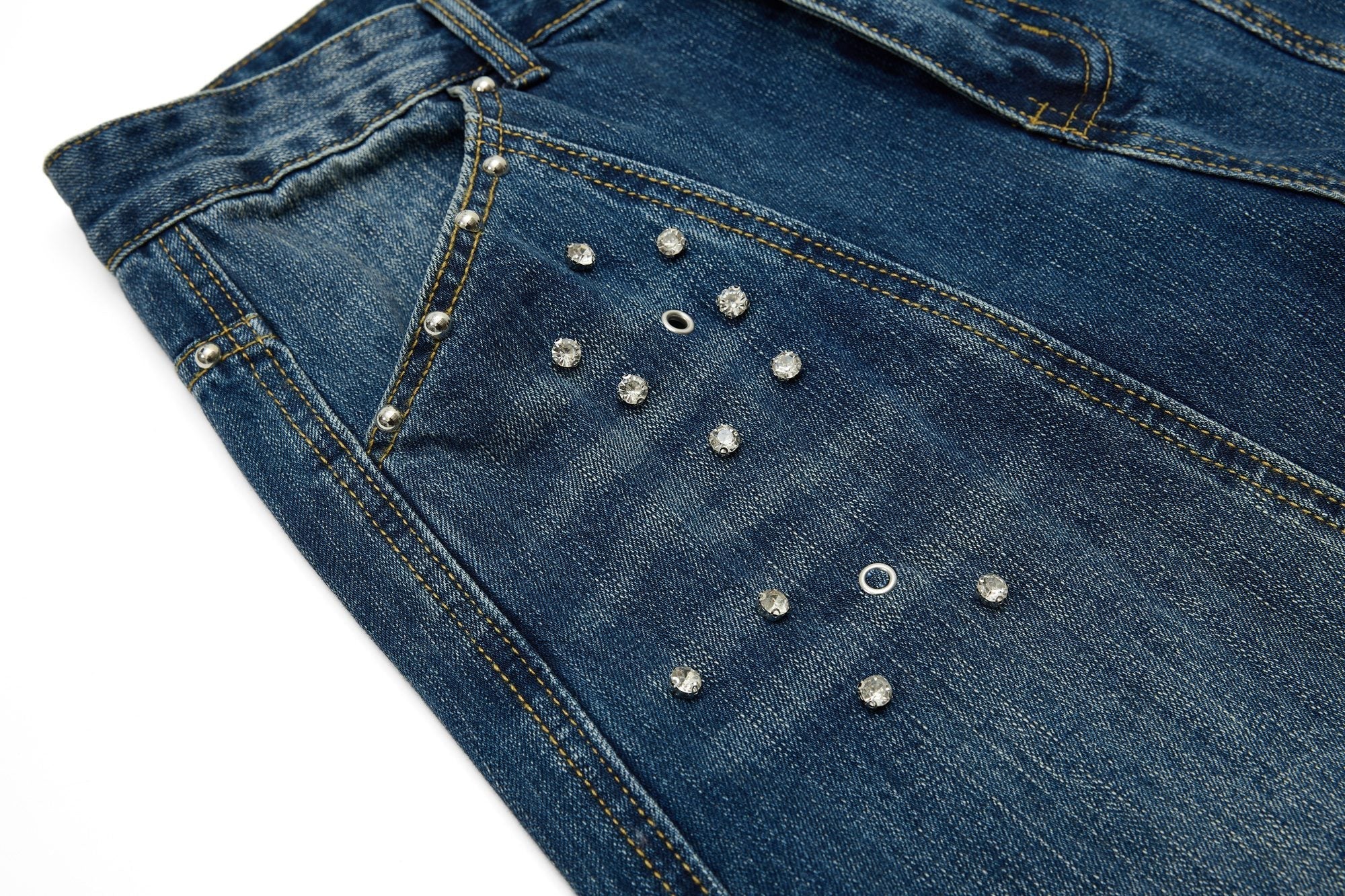CapCabin “Studded Panel Denim Jeans”