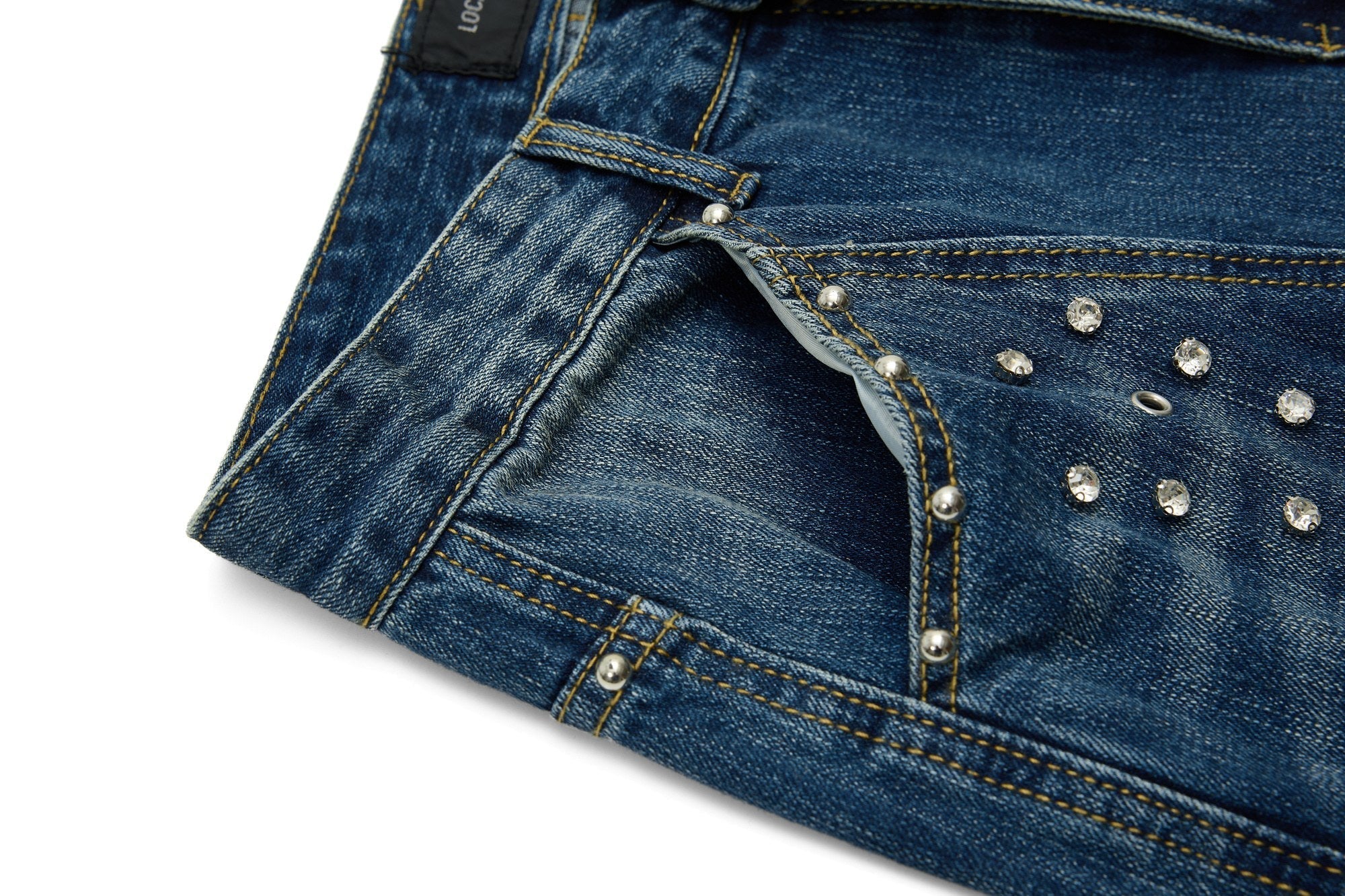 CapCabin “Studded Panel Denim Jeans”