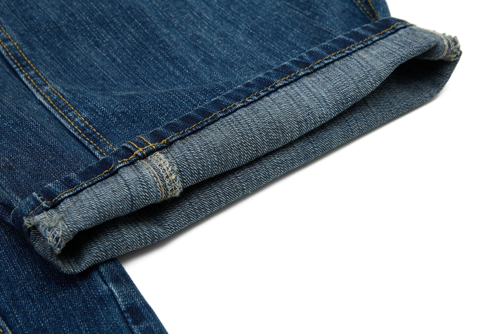 CapCabin “Studded Panel Denim Jeans”